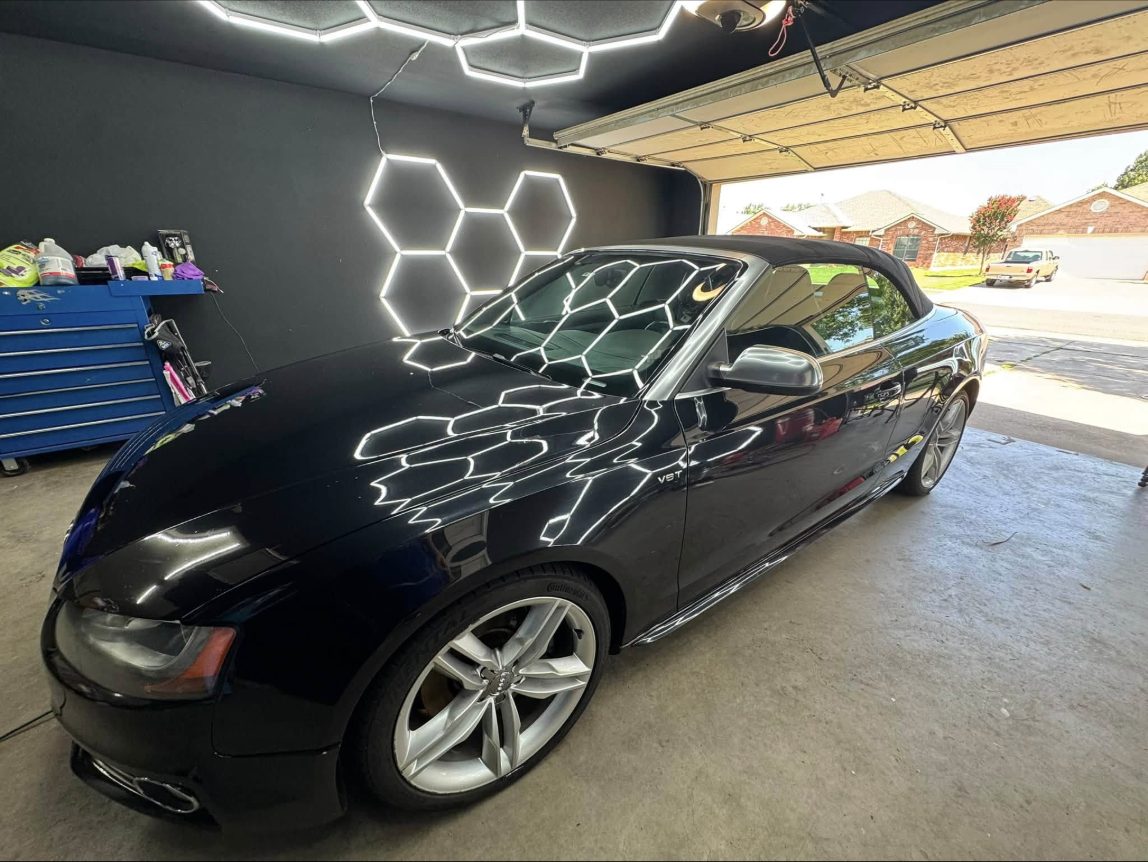 Black Audi S5 convertible in the shop after detailing