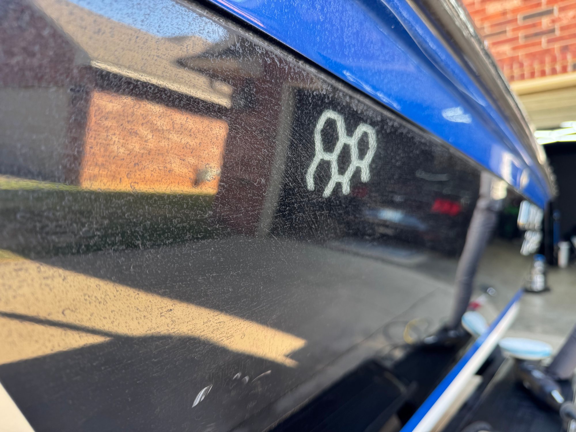 Before: the A17 hex logo drawn into the chalky oxidation on the black hull
