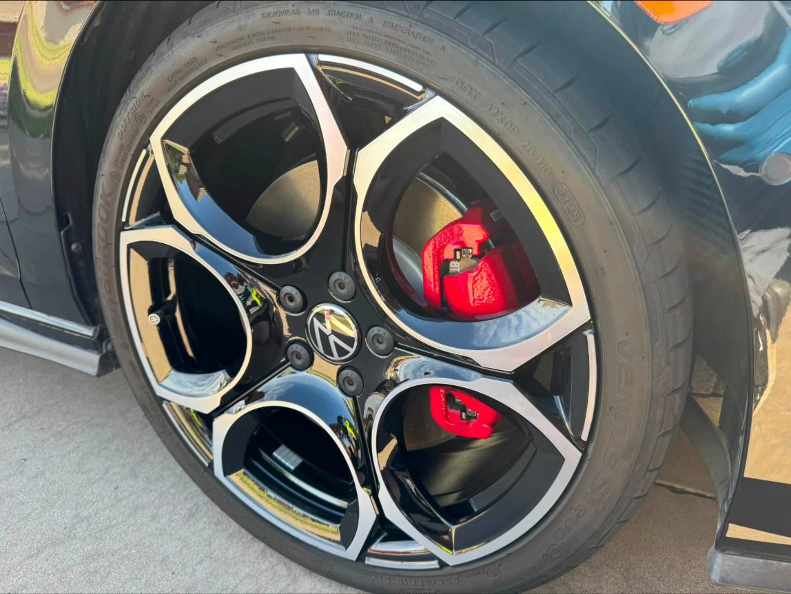 Coated VW GTI wheel with red caliper