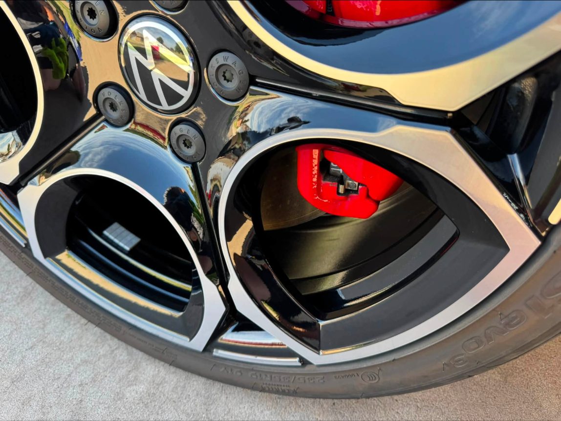 VW GTI wheel and red brake caliper, cleaned and dressed